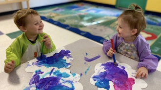 Kids paint a picture.
