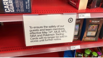 Target sign telling customers they aren't selling trading cards in stores