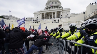 Rioters try to break through police barrier at US Capitol on Jan. 6.