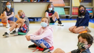 In this May 18, 2021 file photo, fifth graders wear face masks