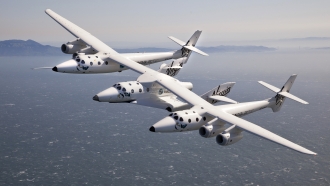 VMS Eve and SpaceShipTwo fly over the San Francisco Bay