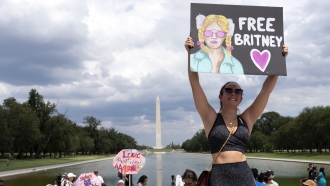 A woman holds a "Free Britney" sign at a protest against Britney Spears' conservatorship in Washington D.C.