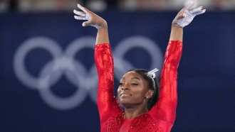 Simone Biles, of the United States, performs on the vault