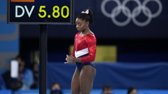 Simone Biles waits to perform on the vault during the artistic gymnastics women's final.