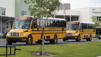 School buses line up for students outside Audubon Park Elementary School.