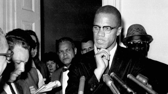 Civil rights leader Malcolm X speaks to reporters in Washington, D.C.