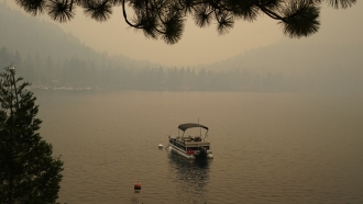 Smoke from the Caldor Fire shrouds Fallen Leaf Lake near South Lake Tahoe, California