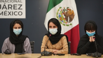 Members of the Afghan all-girls robotics team attend a press conference after arriving in Mexico