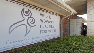 Clinic manager Angelle Harris walks in the front door of the Whole Woman's Health clinic in Fort Worth, Texas.