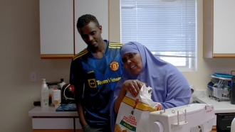 A refugee mother and son in their kitchen in North Dakota