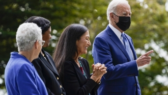 President Joe Biden gestures on the North Lawn of the White House