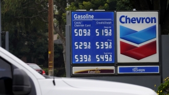 Gas prices displayed on a Chevron sign.