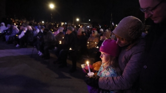 Vigil following fatal Christmas parade tragedy