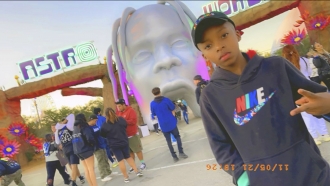 9-year-old Ezra Blount outside the entrance to the Astroworld music festival