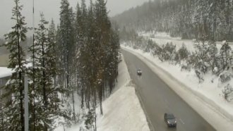 Snow surrounds I-80 in Northern California.