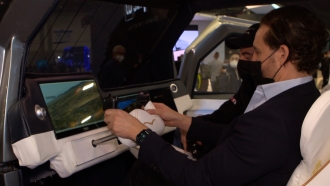 A man drives a concept flying car at CES.