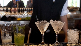 A bartender prepares alcoholic drinks at a restaurant in San Francisco.