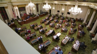 Members of California's Electoral College cast their votes at the state Capitol.