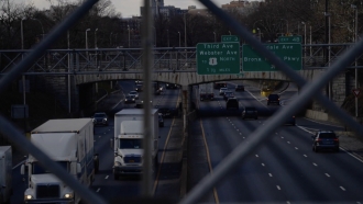 Cars and trucks appear on a Bronx highway