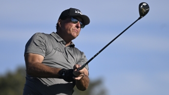 Phil Mickelson hits his tee shot on the fifth hole of the South Course at Torrey Pines