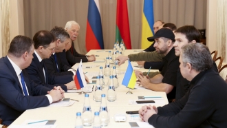 Russian and Ukrainian officials engage in peace talks.