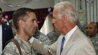 Then-U.S. Vice President Joe Biden talks with his son U.S. Army Capt. Joseph R. "Beau" Biden III