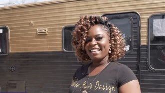 De'quoia Freeman stands outside of her mobile hair salon