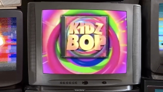 A TV shows an image of Kidz Bop.