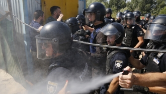 Police use tear gas against Ukrainian residents.