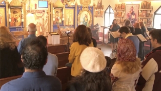 People stand in a church.