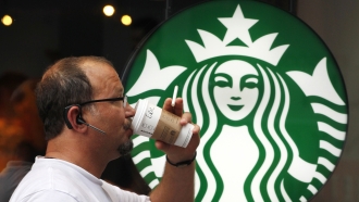 A Starbucks customer drinks coffee