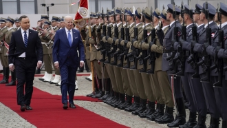 President Joe Biden participates in an arrival ceremony with Polish President Andrzej Duda at the Presidential Palace