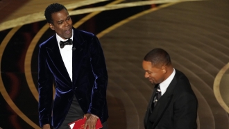 Presenter Chris Rock reacts after Will Smith slapped him onstage at the Oscars.
