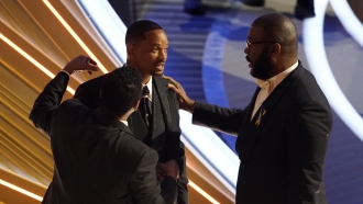 Sean Combs, from left, Will Smith and Tyler Perry appear in the audience at the Oscars