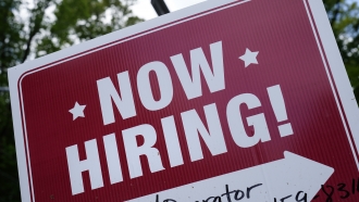 A "now hiring" sign