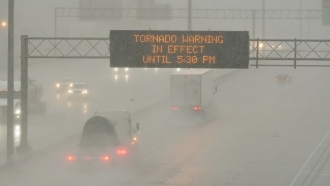 A transportation digital message says a tornado warning is in effect.