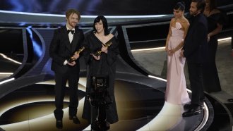 Billie Eilish and Finneas accept their Oscar award.