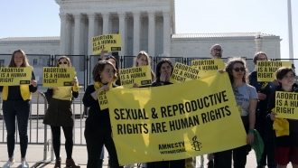 Abortion rights activists protest outside of the U.S. Supreme Court, Wednesday, May 11, 2022.