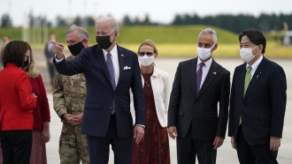U.S. President Joe Biden disembarks from Air Force One on his arrival at Yokota Air Base.