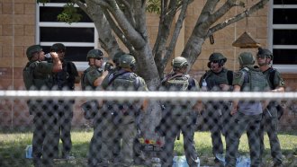 L:aw enforcement personnel outside of Robb Elementary School in Uvalde, Texas