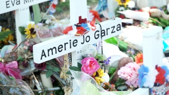 A cross for Amerie Jo Garza at the Robb Elementary School memorial site