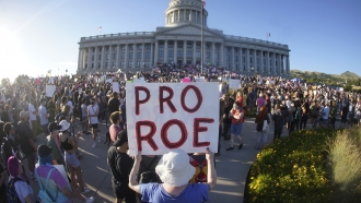 People attend an abortion-rights protest at the Utah State Capitol in Salt Lake City