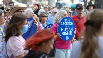 Protesters gather at a rally in support of abortion rights outside a federal courthouse in Santa Fe, N.M