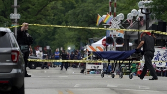 A stretcher is seen after a mass shooting at the Highland Park Fourth of July parade