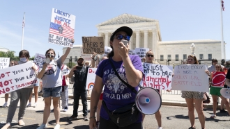 Abortion-rights activists protest outside the Supreme Court in Washington, D.C.