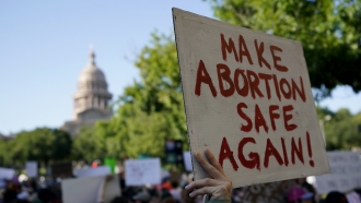 Demonstrators march for the right to an abortion.