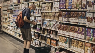 A man shops at a supermarket.