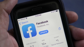 The Facebook app is shown in the app store on a smart phone