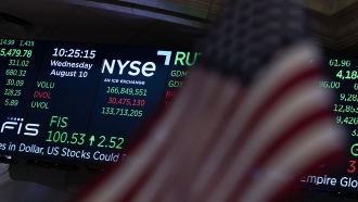 Market data is displayed at the New York Stock Exchange.