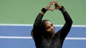 Serena Williams motions a heart to fans after losing to Ajla Tomljanovic in the U.S. Open.